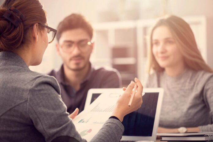 Accountant explaining accelerated depreciation methods to business clients