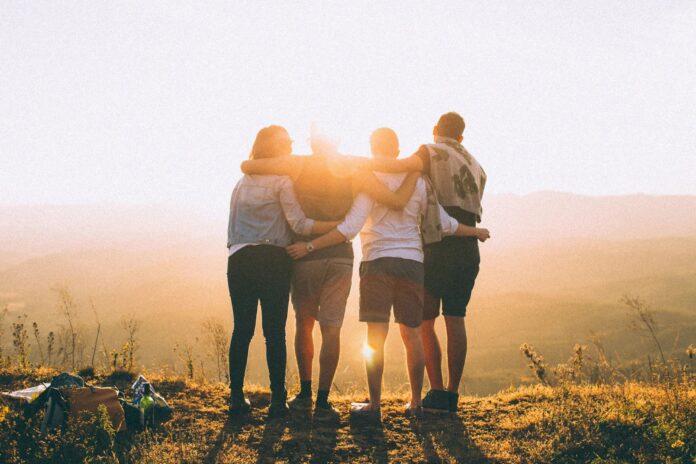 Diverse group of people connected by trust, representing honesty in business, education, family, and community