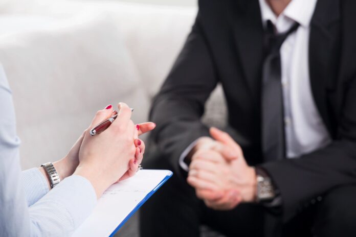 Canadian professional negotiating salary with manager