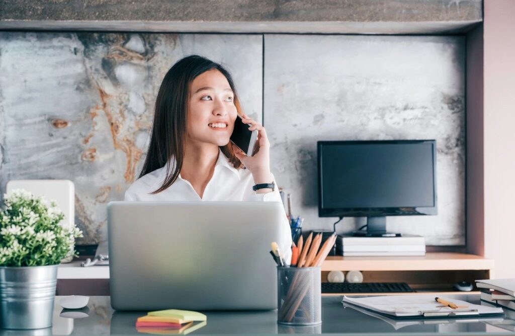 Canadian accountant reviewing financial documents in an office setting.