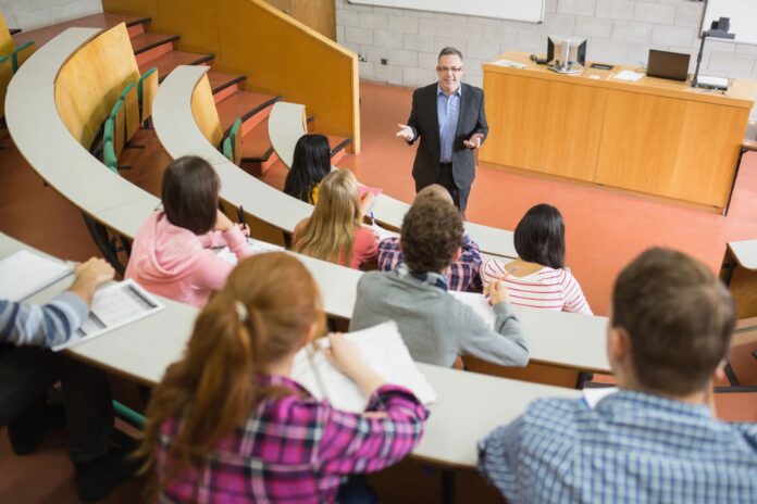 Accounting professor teaching his students about Debits and Credits in accounting.